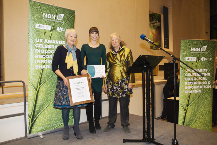 Mary Tayler and Laura Millar receiving the award from Lynne Farrell
