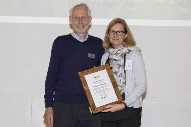 Helen Roy receiving Honorary Membership from Michael Hassell