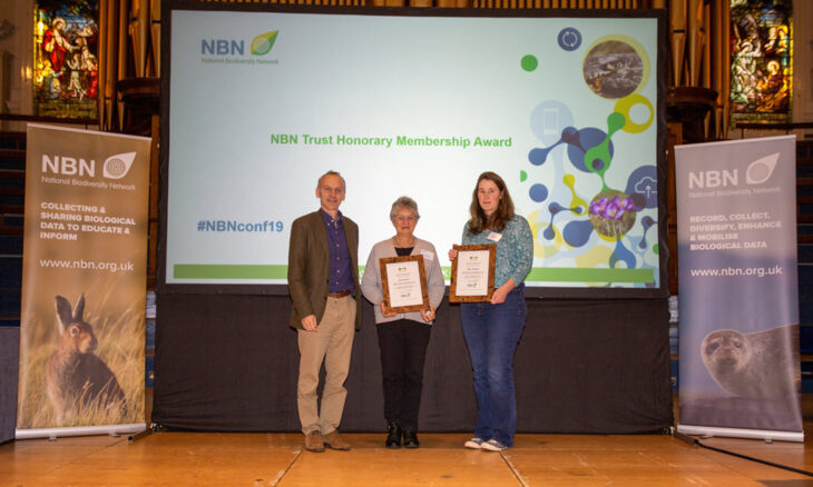 Neil Hodges presents the award to Sally Rankin (middle) and to Clare Blencowe on behalf of Mile Weideli