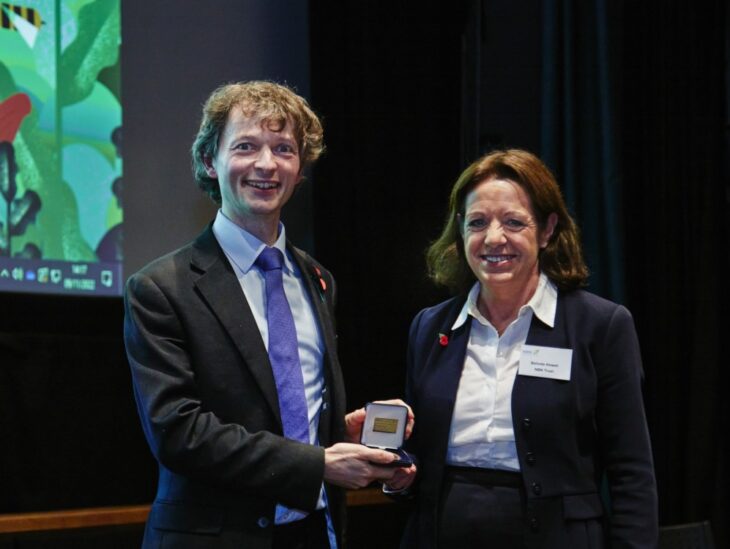 Richard Benwell receiving the memorial lecture medal from NBN Trustee, Dr Belinda Howell