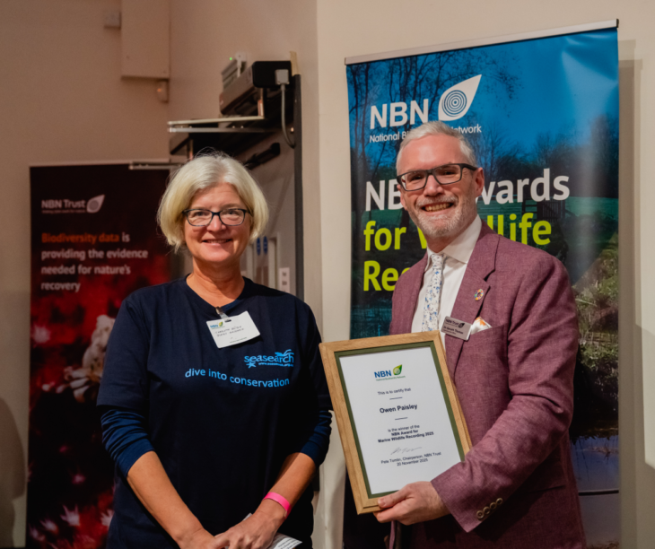 Charlotte Bolton accepting Owen Paisley's award on his behalf