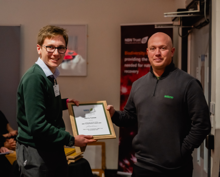 Henry Colnet NBN Young person's Award winner 2025 accepting his award from sponsor Rob Laughton, Opticron