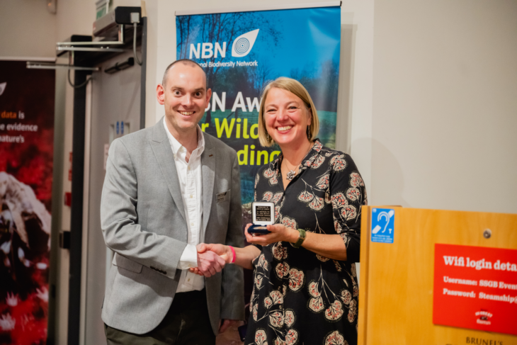 Katie-jo Luxton receiving the Sir John Burnett Memorial Lecture Medal 2025 from NBN Trust Chairperson, Pete Tomlin