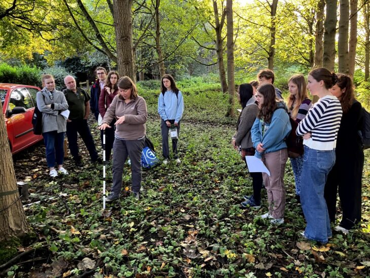 One of the NHMP team leading a team of volunteers in the field