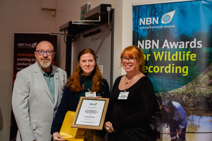Tony Davison and Emily Milnes from the Joint Derbyshire Moth Verification Group winner of the NBN Group Award 2025 receiving the Award from sponsor Ellen Monaghan,, Field Studies Council